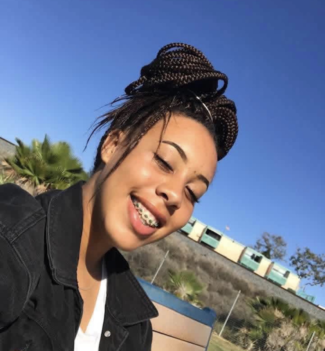 Jazzie smiling in the sunshine