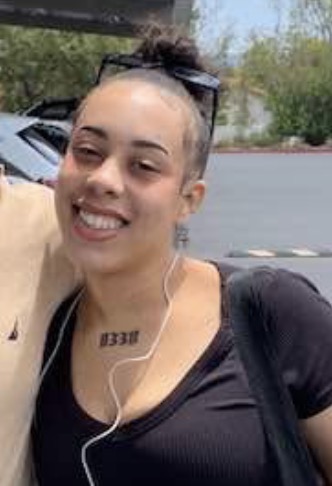 Jazzie smiling in the parking lot